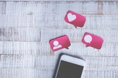 Smart Phone With Paper Cut Social Media Icons In Speech Bubble