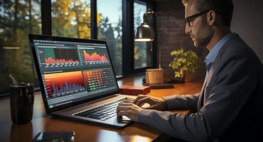 Digital Marketing Professional Typing On Keyboard With Budget Spreadsheet.