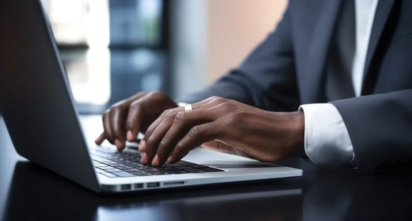 Developer Typing Code On Laptop.